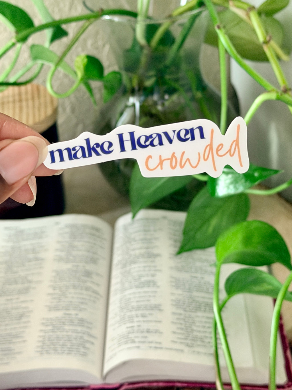 Vinyl Christian sticker that says "make Heaven crowded" in purple and gold